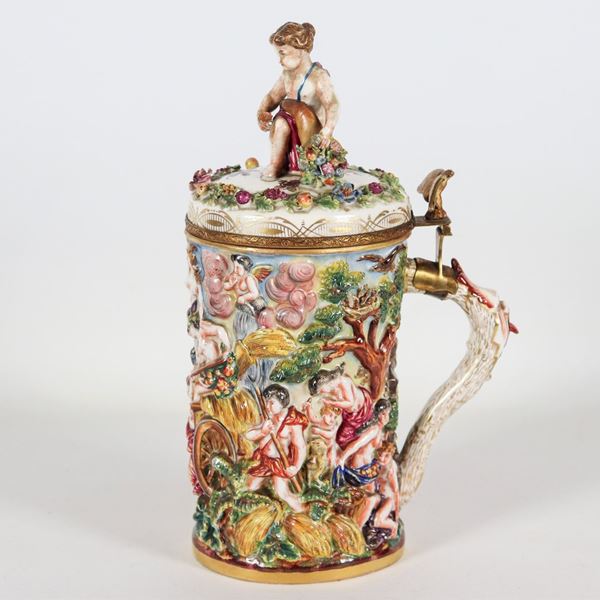 Large mug in Capodimonte historiated porcelain, entirely decorated in polychrome with mythological scenes in relief