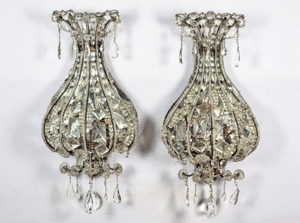 Pair of rounded crystal and metal sconces, with prisms, beading and mirrored background, 2 lights each