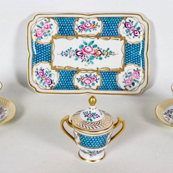 Colorful porcelain tete a tete with motifs of bunches of flowers and highlights in pure gold: rectangular tray, sugar bowl and two cups with saucers (4 pcs)