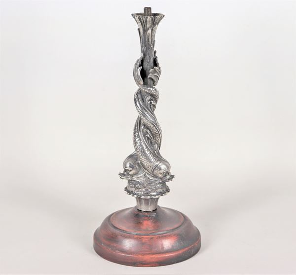 Silver sculpture with chiselled and torchon-embossed dolphins on a branch of leaves, wooden base and provision for electric light