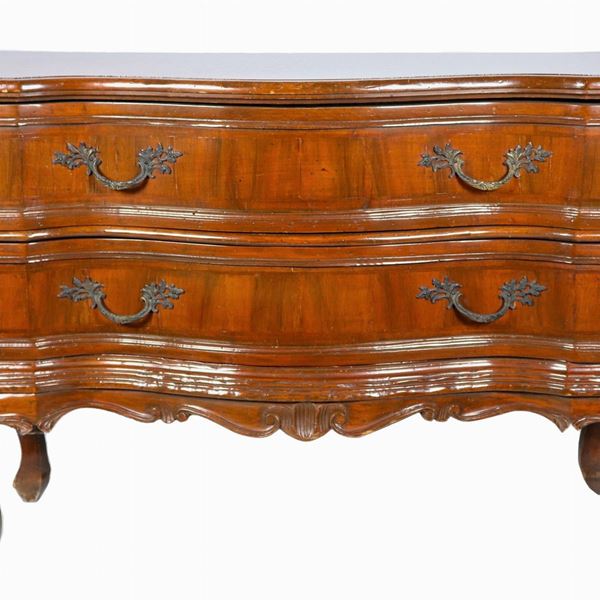 Walnut chest of drawers from the Louis XV line with arched front, two drawers and four curved legs