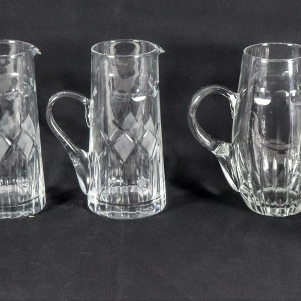 Lot in worked crystal of three jugs, eleven goblets and six flutes, slight chipping (20 pcs)