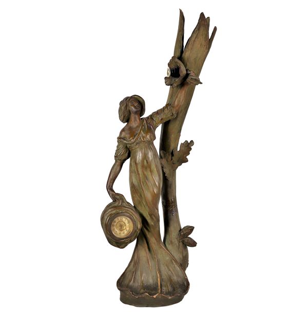 French Art Nouveau terracotta sculpture with faux bronze patination "Woman with clock", various breaks