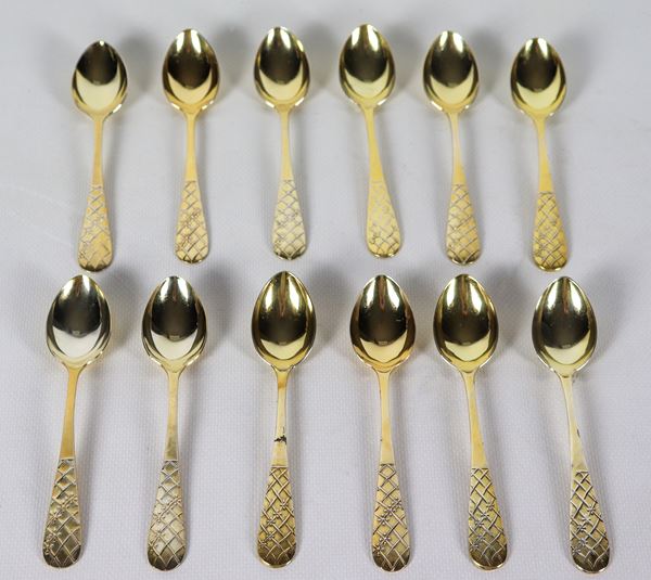 Lot of twelve Russian silver vermeil tea spoons with chiselled handles, Title 875, gr. 300