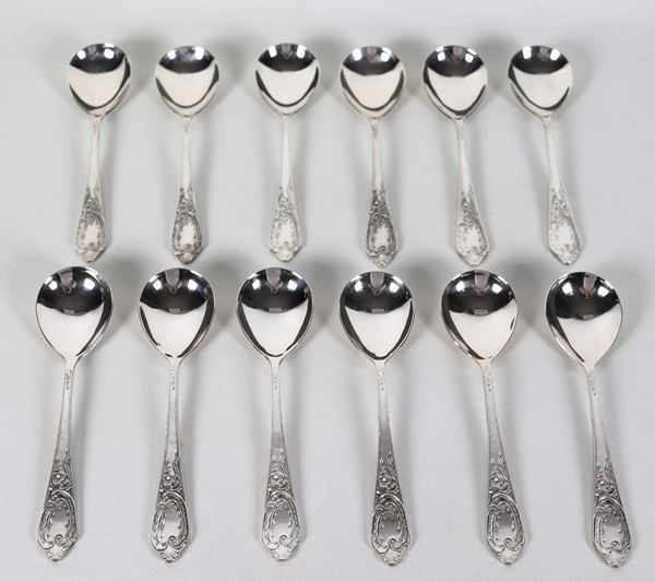 Lot of twelve Russian silver soup spoons with chiseled and embossed handles, Title 875, gr. 640