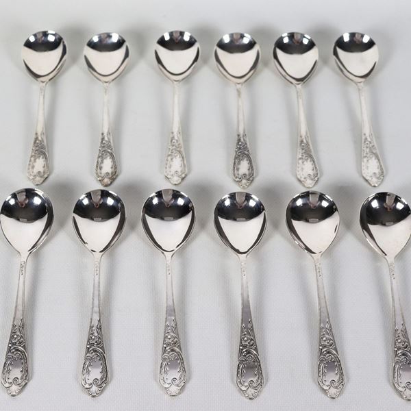 Lot of twelve Russian silver soup spoons with chiseled and embossed handles, Title 875, gr. 640