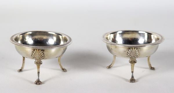 Pair of ancient Neapolitan silver salt shakers in the shape of a tripod, with feet and edges chiselled and embossed with neoclassical motifs, gr. 140