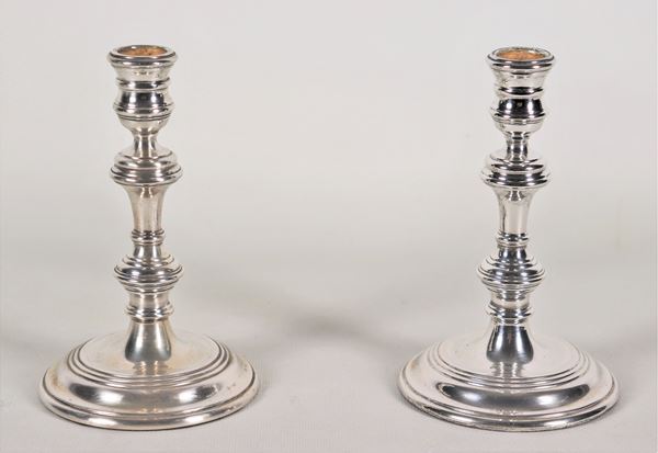 Pair of small silver candlesticks with turned stem