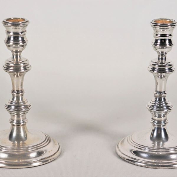 Pair of small silver candlesticks with turned stem