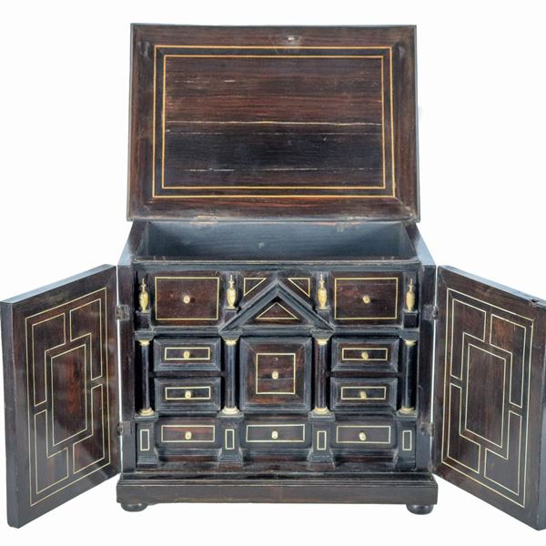 Ancient small walnut coin chest with geometric inlays, series of drawers and columns inside, opening top and two doors underneath, some lacks