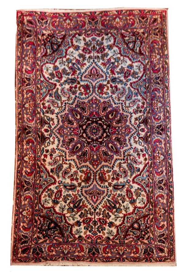 Persian carpet with geometric and floral design on a red and havana background, M 1.51 x 0.86