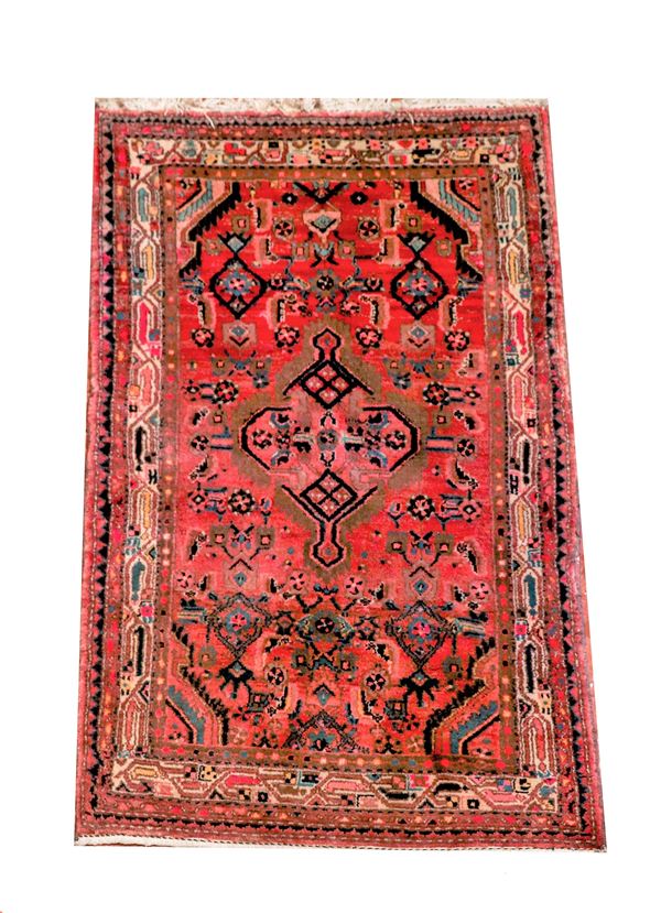 Persian carpet with geometric design on a red background with light border, M 1.85 X 1.05