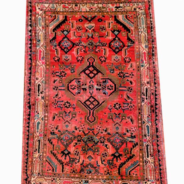 Persian carpet with geometric design on a red background with light border, M 1.85 X 1.05