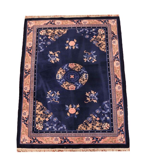 Chinese Beijing carpet with a naturalistic floral design on a blue, havana and pink background, M 2.80 x 1.84