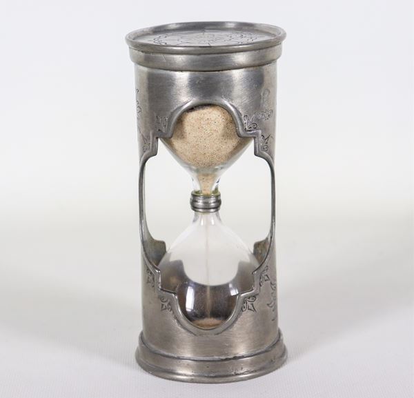 Ancient hourglass in chiseled pewter