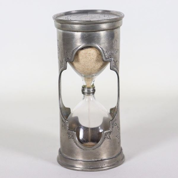 Ancient hourglass in chiseled pewter