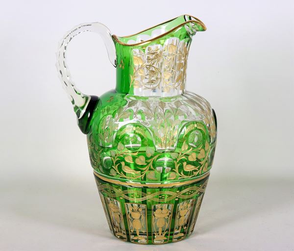 Large green Bohemian crystal jug, entirely decorated and engraved in pure gold with floral scrolls, vases with flowers and birds
