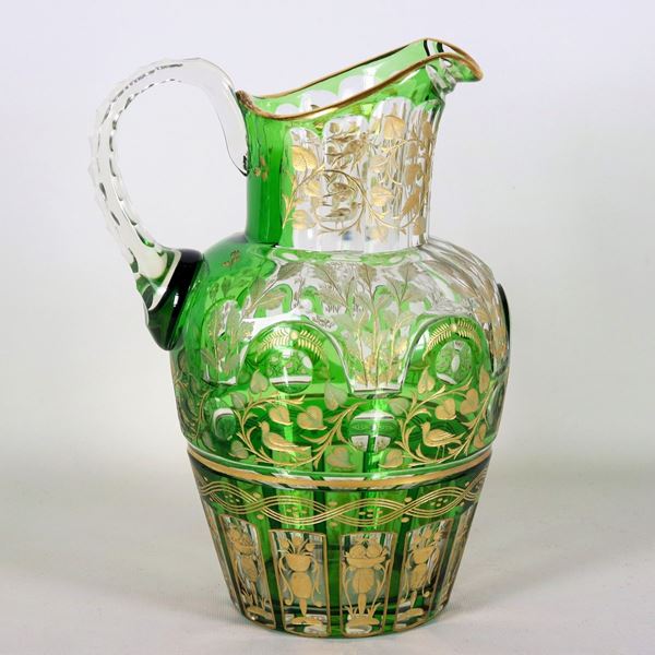 Large green Bohemian crystal jug, entirely decorated and engraved in pure gold with floral scrolls, vases with flowers and birds