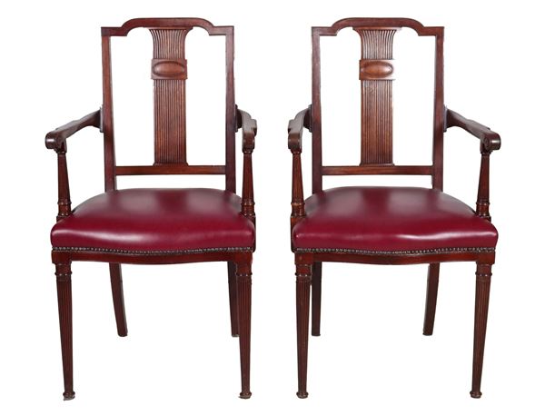 Pair of English mahogany armchairs, with carved backrests and pod legs, amaranth leather cover