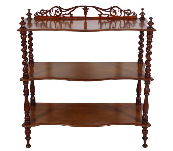 Three-storey walnut etagere with turned columns uprights, small carved cymatium on the top