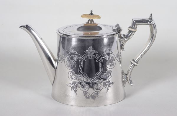 Antique English Victorian Sheffield teapot, chiselled and embossed with floral and shield motifs. Minor defects