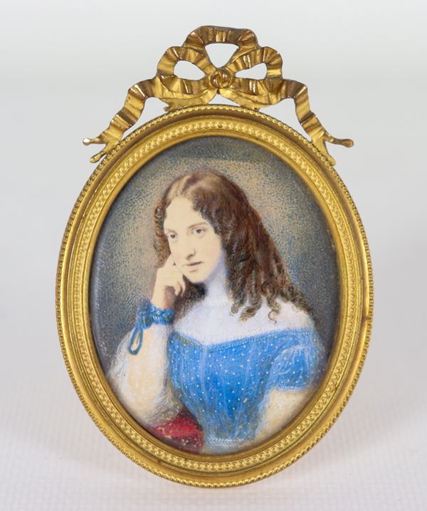 "Portrait of a young girl", ancient small painted oval miniature, 19th century. Signed and dated