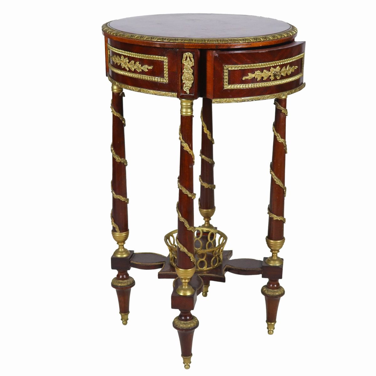 Tavolo francese da centro a forma tonda di linea Impero, in ebano viola e mogano, con guarnizioni...