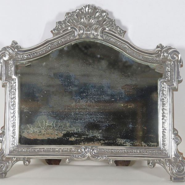 Ancient chiselled and embossed silver card with Louis XV motifs, slightly defective mercury mirror and wooden support