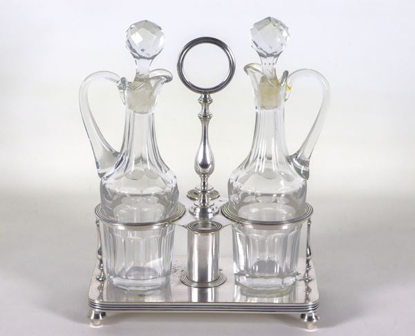 French cruet from the Impero line, in silvered metal with two crystal cruets, one with a slight defect on the edge of the neck