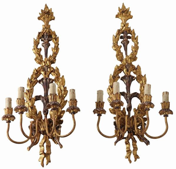 Pair of Louis XVI wall sconces in gilded, silvered and carved wood, four lights each