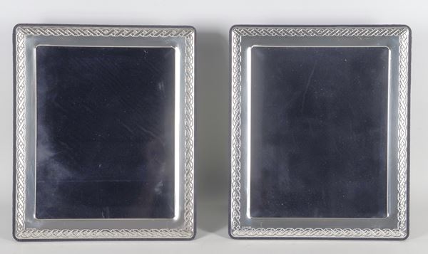 Pair of silver portrait frames with stylized Savoy knot embossed edge