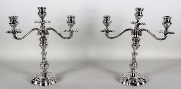Pair of embossed and chiseled silver candlesticks with Louis XV motifs, 3 flames each, gr. 1720