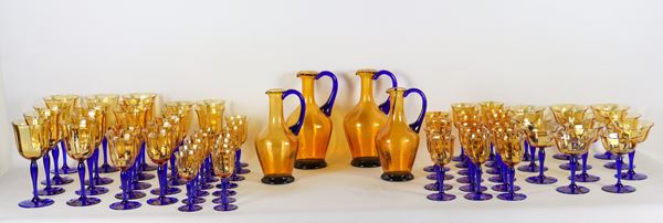 Set of amber-colored Murano blown glass glasses with blue stem, 1930s-40s, (63 pcs)