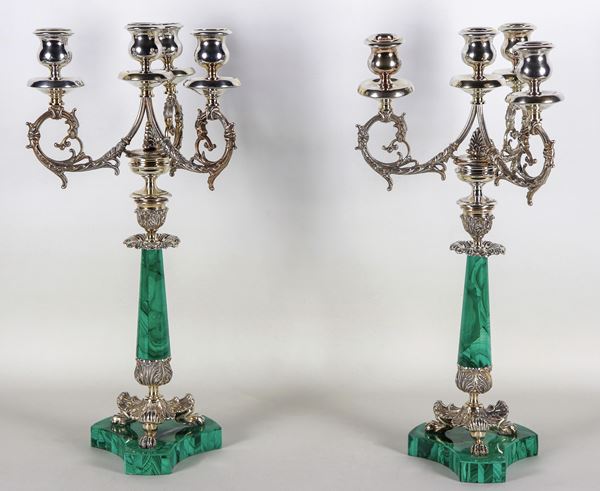 Coppia di candelabri in argento cesellato e sbalzato, con fusti e basi in pietra dura di malachite, peso dell'argento gr. 2000 circa