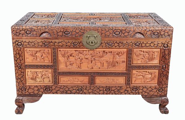 Chinese wedding chest in camphor wood, entirely decorated with panels with small sculptures of oriental life scenes