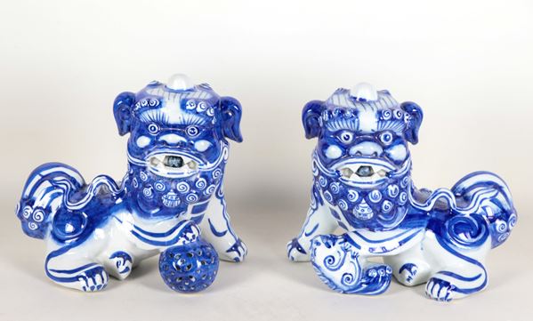 Pair of Chinese Foo dogs in blue and white porcelain