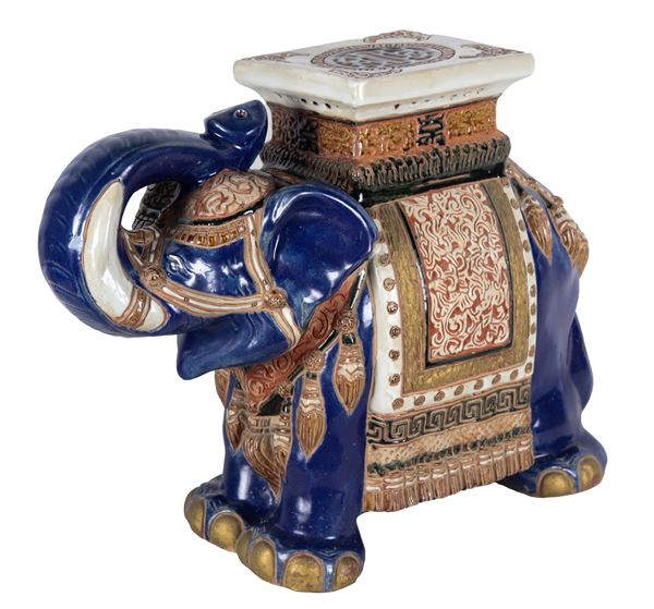 Oriental stool in the shape of an elephant in polychrome porcelain decorated in relief