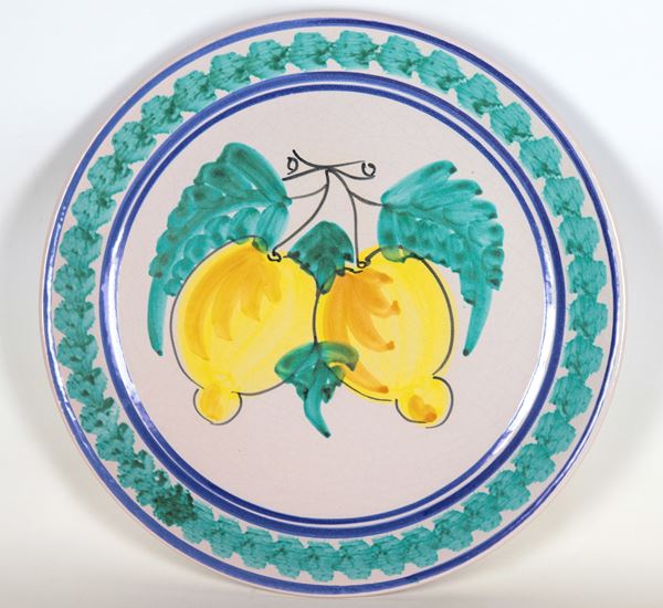 Large Neapolitan majolica wall plate with green decorations, lemons in the centre
