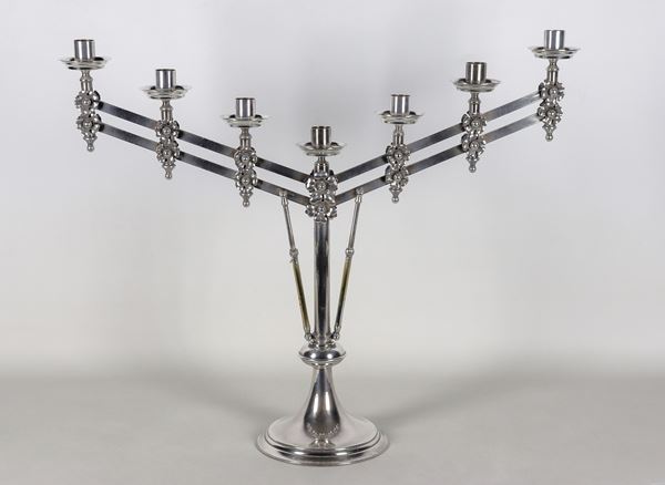 Menorah candelabra in silvered metal, embossed and chiselled with seven flames