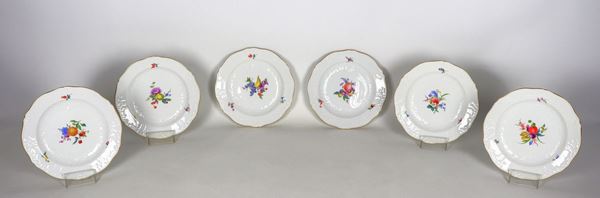 Lot of six small Meissen porcelain plates, with decorations painted in relief with flower and fruit motifs, pure gold edges