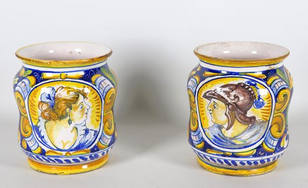 Pair of Caltagirone majolica albarelli entirely decorated and colorful with scrolls of leaves and flowers, medallions with "Soldier" and "Nobildonna" in the center