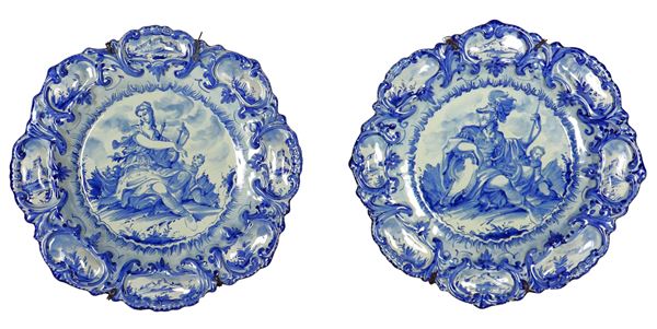 "Mars" and "Tersicore", pair of large majolica parade plates from Albisola, decorated in blue on a white background. Marked M.G.A. (Giuseppe Mazzotti Traditional and Modern Art Ceramics Factory), executed by Romeo Bevilacqua 1937