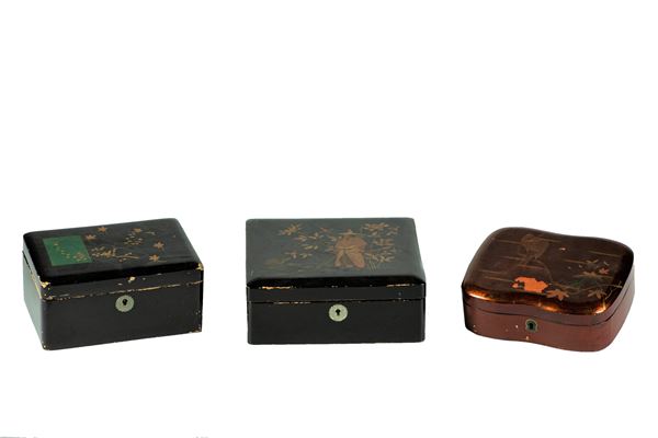 Three boxes in black and red lacquered wood