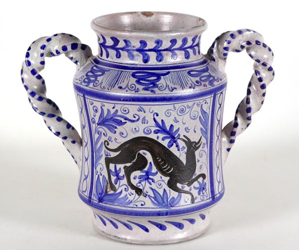 Small amphora with twisted handles in Faenza majolica, with blue animal and flower decorations. Slight chips