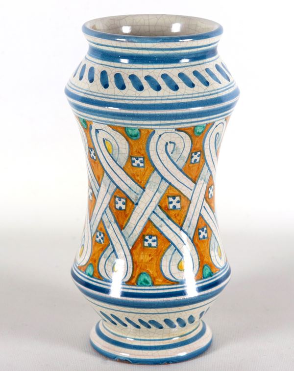 Albarello in Sicilian majolica decorated with geometric interweaving motifs on a yellow ocher background