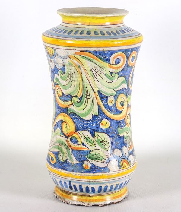 Large Sicilian majolica albarello, with polychrome floral scroll decorations on a blue background. Defects at the base