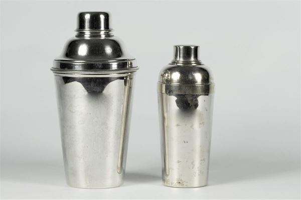 Two silver metal shakers