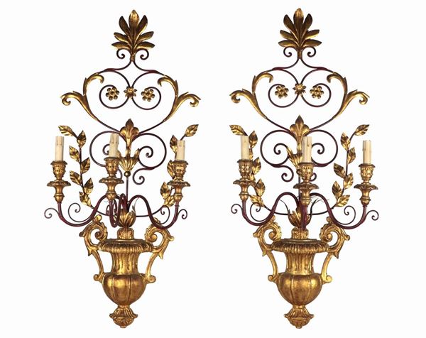 Pair of gilded wood and wrought iron appliques in the shape of amphorae with branches and flowers, 3 lights each