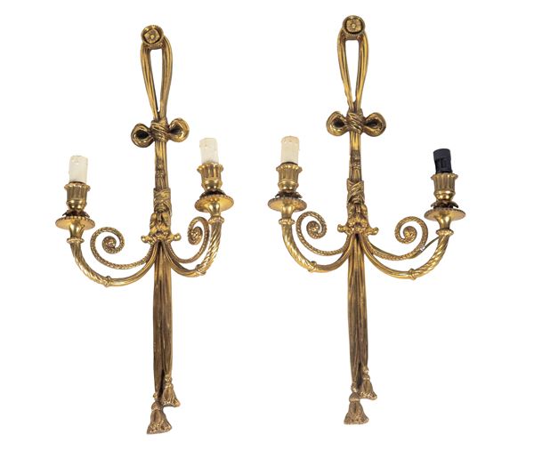 Pair of French sconces in gilt bronze, embossed and chiseled with Louis XVI bow motifs, 2 lights each