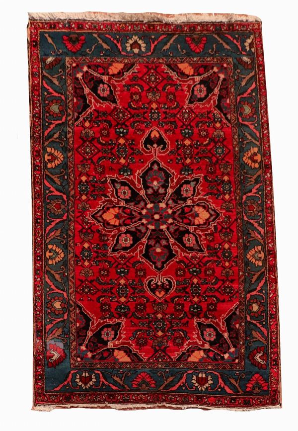 Persian Shirvan carpet with woven floral designs on a red background with blue border, M 2.03 X 1.33